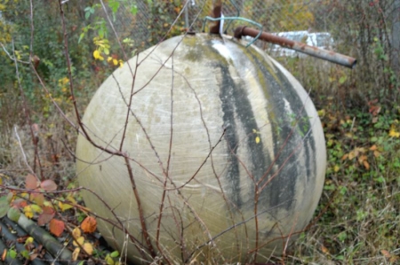 Fiberglass tank, spherical shape. Diameter estimated 2 meters