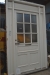 Front door with sidelight, wood, white. Bar windows with frosted glass. Frame dimensions approximately 149 x 247 cm