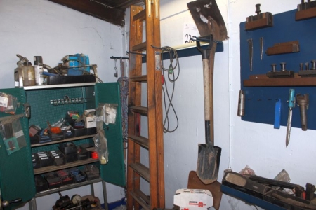 Everything in the corner: Ladder + shovels + miscellaneous tools + chair etc.