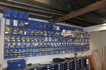 Wall with assortment boxes around 45 pcs. containing rivets + auto lamps + clamp + discs + wingnuts, etc.