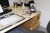 El sit / stand desk with content + drawer containing daf office supplies