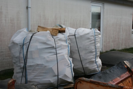 Cut-off timber in big bags, suitable for burning. Archive picture