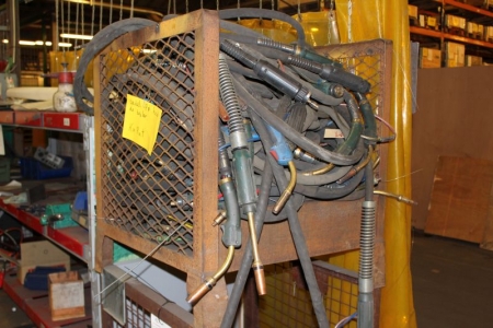 2 steel cages with welding cable, of which one cage with cable labeled as defective