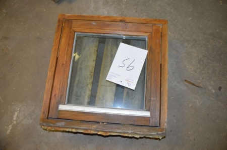 Wooden windows with clear glass top mounted