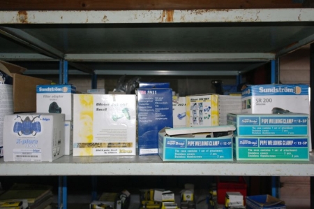 Content on the shelf; Assorted Protective clothing, about 10 boxes