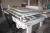 Robot: Promet Automation type Compact S2000 CE1, Year 1998, SN: 9707530102. inclusive 2 rotation feeding tables and security fence. The machine is not in operation order and perhaps incomplete.