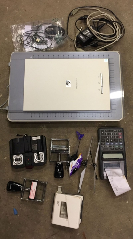 Flatbed scanner, mouse, helicopter, calculator, stamps.
