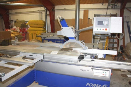 Sliding table saw, Format 4, Kappa 40/06. X-motion. CNC controlled. Scoring aggregate. Sliding table + special index system table for angled topics. Year 2009. SN: 61.10.056.09. Extraction to the damper included