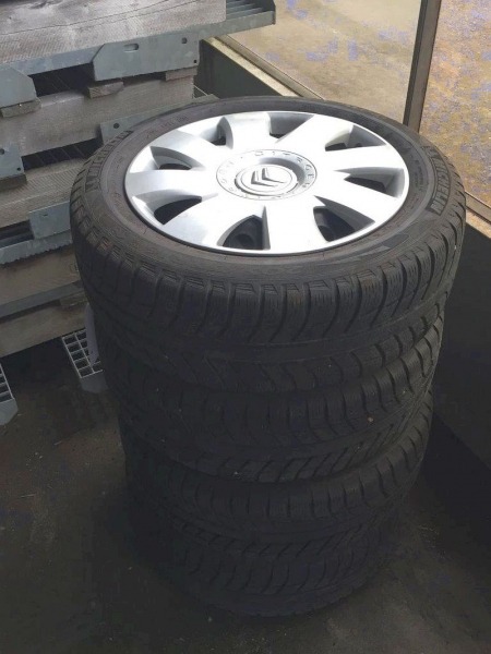4 winter tires on steel rims with Citroën hubcap, 205/55 R16