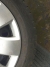 4 winter tires on steel rims with Citroën hubcap, 205/55 R16