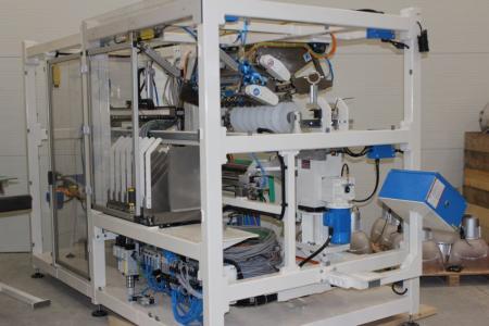 Paper / foil cutter / wrapper, from the year 2012, consisting of div. Industrial Components, including 3 pieces. electric motors from Siemens (unknown capacity) and Siemens security system and Simens touch panel, Festo components, including air hoses, air