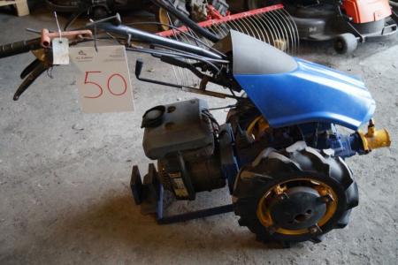 Two-wheeled tractor with a broom, snow blade and carriage. Starts and runs
