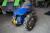 Two-wheeled tractor with a broom, snow blade and carriage. Starts and runs