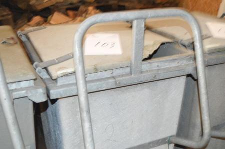 Waste container on wheels with handle. Lid condition unknown