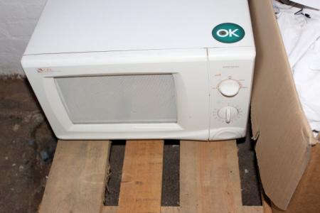 Microwave + box of tea towels and cloths