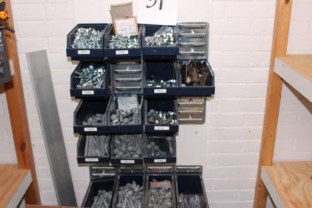 Assortment boxes on a wall containing various bolts and screws, etc.
