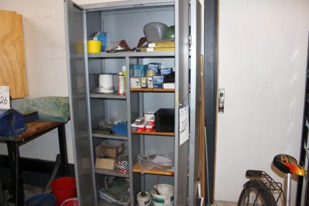 Steel cabinet containing various welding accessories
