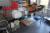 Rustfri bord 63 x 200 cm med indhold af div forme + plastbøtter + køkkenservice + 2 rulleborde