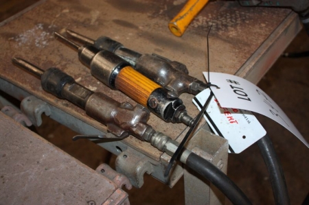 3 hand held pneumatic tools. One labelled "defective"