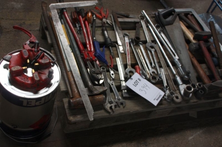 Hand tools on pallet and toolbox with hand tools