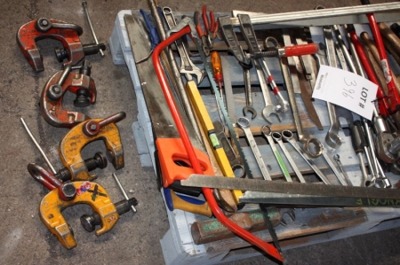 Hand tools on pallet and toolbox with hand tools