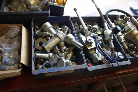 Content on the table, various hydraulic fittings, etc.