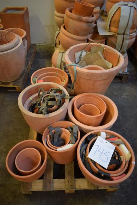 Pallet with various terracotta garden pots