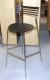 Cafe table 80x80 cm. Bordpolade in black. H: 103 cm. + 4 pcs. bar stools, Brand: Radius 2006. Stools are with steel legs and black wooden seat.