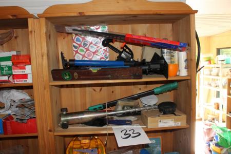 Shelving containing various tools + first aid accessories, etc.
