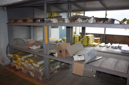 Steel rack with content of welding rods and electrodes on shelves and pallets