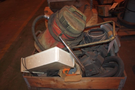 Various vacuum cleaner parts on pallet