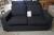 2 pers. Black sofa in fabric m. Loose cushions, low back