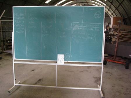 School board on tripod / wheel. Reversible - Whiteboard on one side and chalkboard on the other. Writing surface about 118 x 198 cm