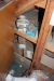 Various staples, abrasive disks, fittings and more under stairway