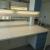 Double Laboratory bench with sink, worktop in HPL, 4 drawers, 2 base cabinets, electrical panel with lighting, gas valves L: 303 H: 150 B: 150