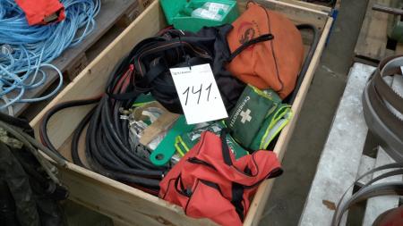 Pallet with various safety belts and air hose.