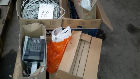 Pallet with various wires and telephones.