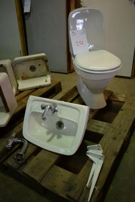 Toilet + sink with faucet + water trap