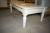 Off-white coffee table, wood with glass. L 140 B X 80 X H 52 cm. Stigmatize the table