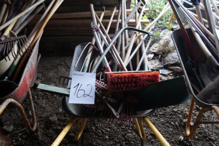 1 piece wheelbarrow with various garden tools.