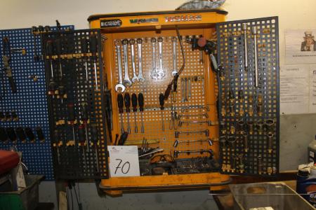 Tool cabinet containing various hand tools, auto tools