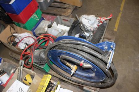 Hose reel to air and pallet with various auto parts