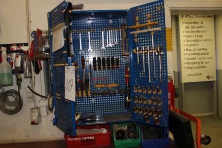 Tool cabinet containing various hand tools, air tools, strips, etc.