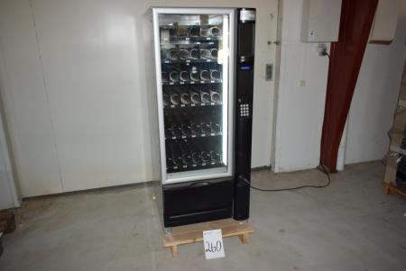 Automat til snacks og drikkevarer til møntindkast, mrk. Snakky .Ny, uden nøgle.Automaten er åbnet og der kan skiftes cylinder. Nypris kr. 23.000,-