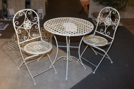 Tisch ø: 69 x H: 74 cm mit zwei passenden Stühlen. Marke nicht bekannt.