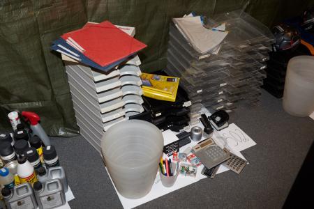 Office supplies among other things has used letter trays, calculators and garbage cans.