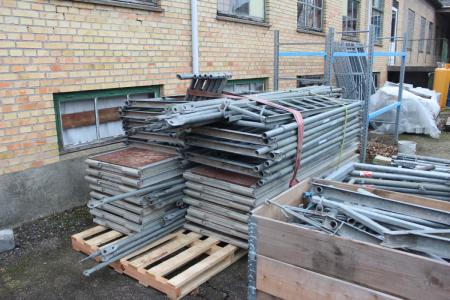 Facade Scaffolding. 15 scaffolding bridges divided into 7 pieces of approx 245 cm and 8 pieces of approx 300 cm. 10 legs / feet, 11 extensions and 18 long