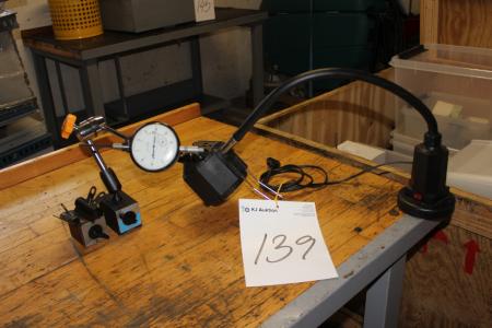 A dial gauge and machine lamp with magnet
