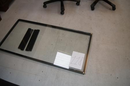 Self assembly coffee table from Hurup furniture, with thick glass and black steel frame.