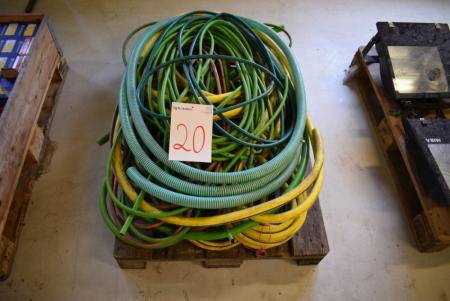 Pallet with various water hoses in different sizes